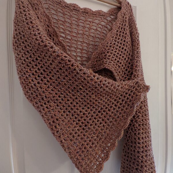 Boléro manches chauve-souris avec détail sur une des manches